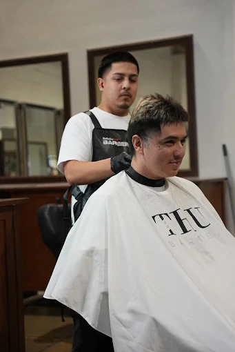 barber student practicing on the student salong with affordable pricing 
